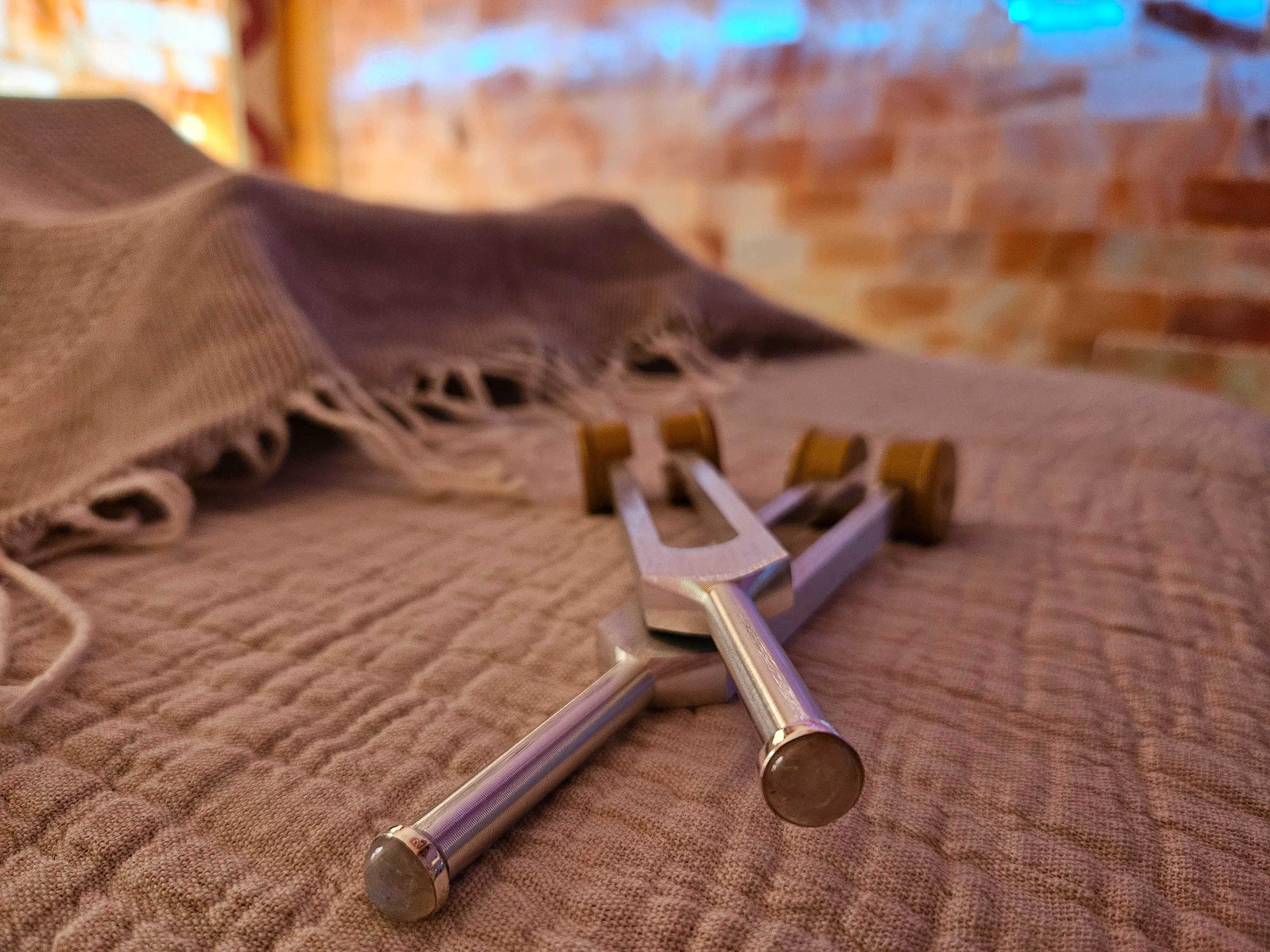 Acutonics® tuning forks arranged on a treatment table