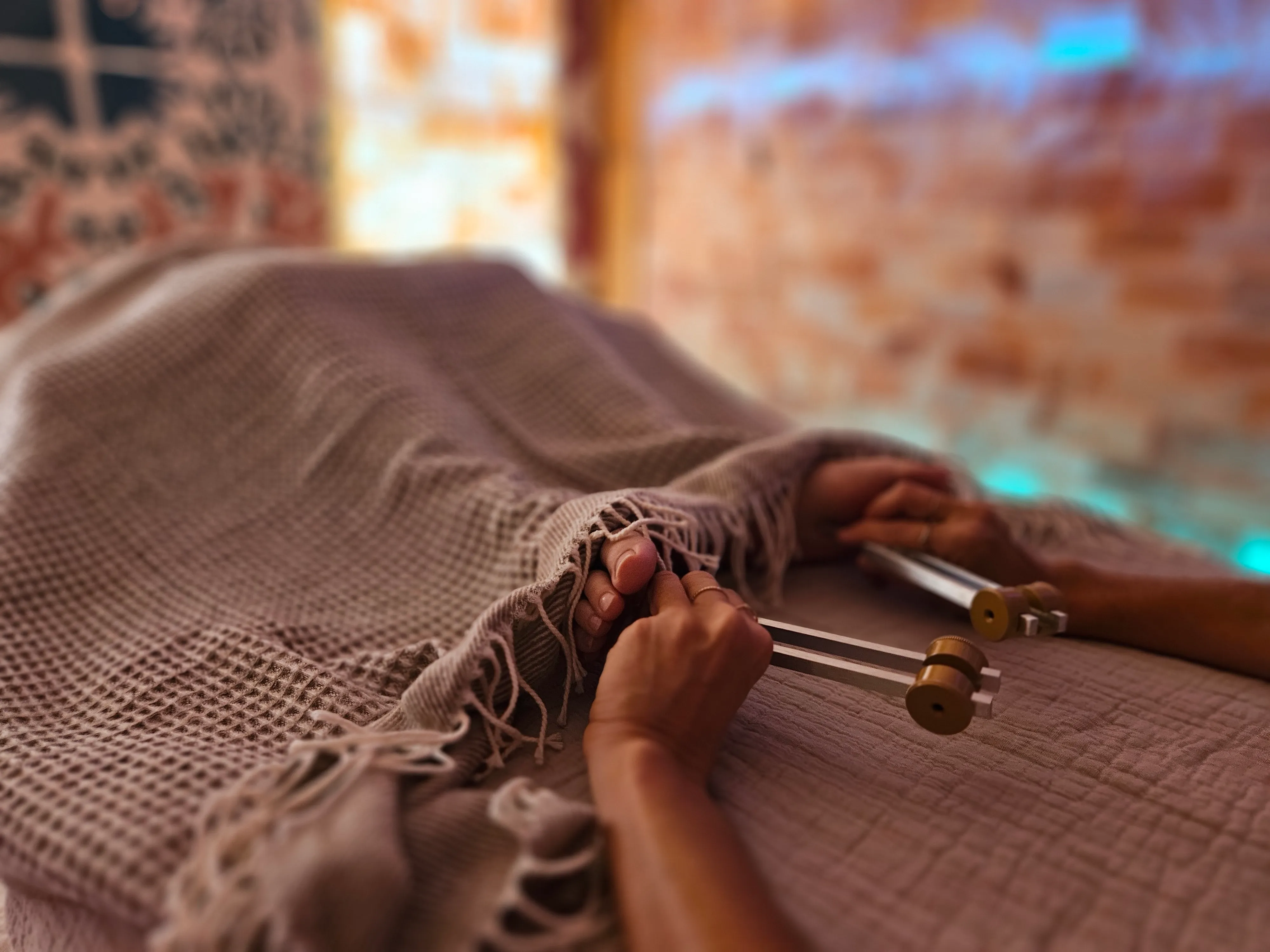 Hands during a sound healing session